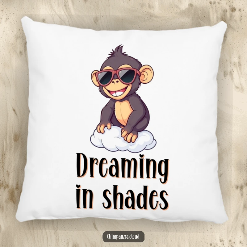 Funny chimp wearing sunglasses, resting on a soft cloud, depicted on a comfortable, humorous decorative pillow.