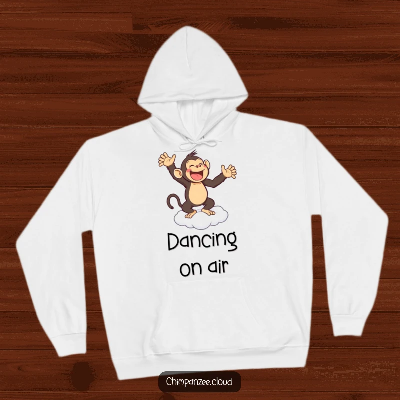 Funny hoodie featuring a joyful chimpanzee gleefully dancing on a cloud, offering comfort and whimsical delight.