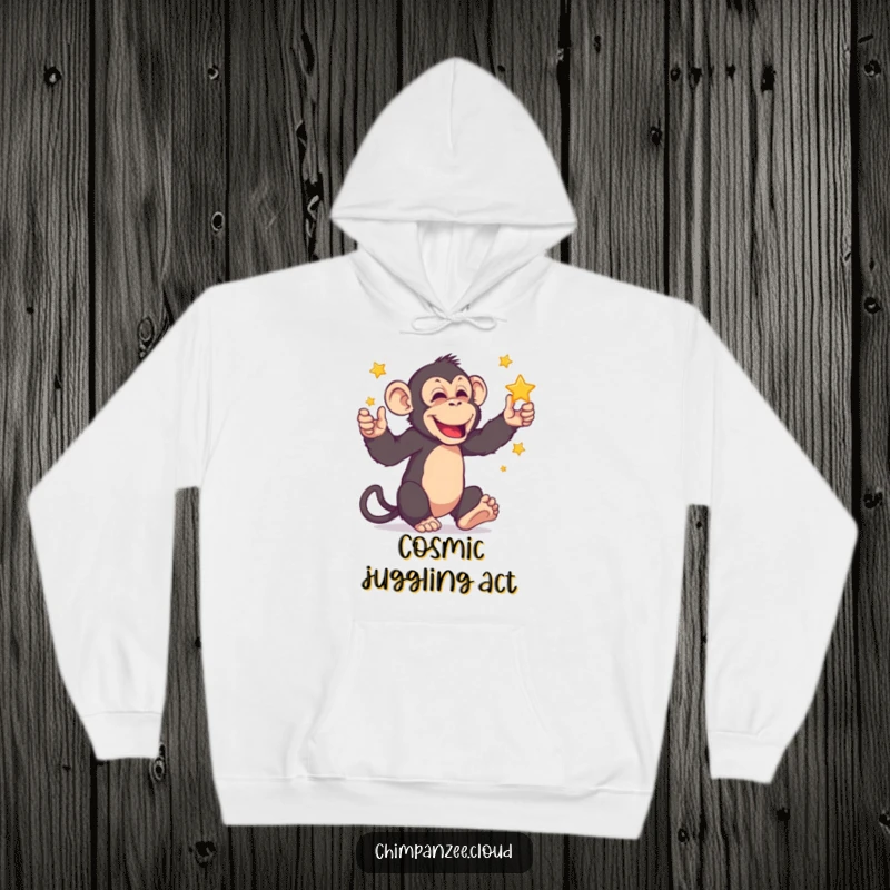 Funny chimpanzee character juggling miniature stars, featured on a soft hoodie, blending celestial fun with cozy warmth.