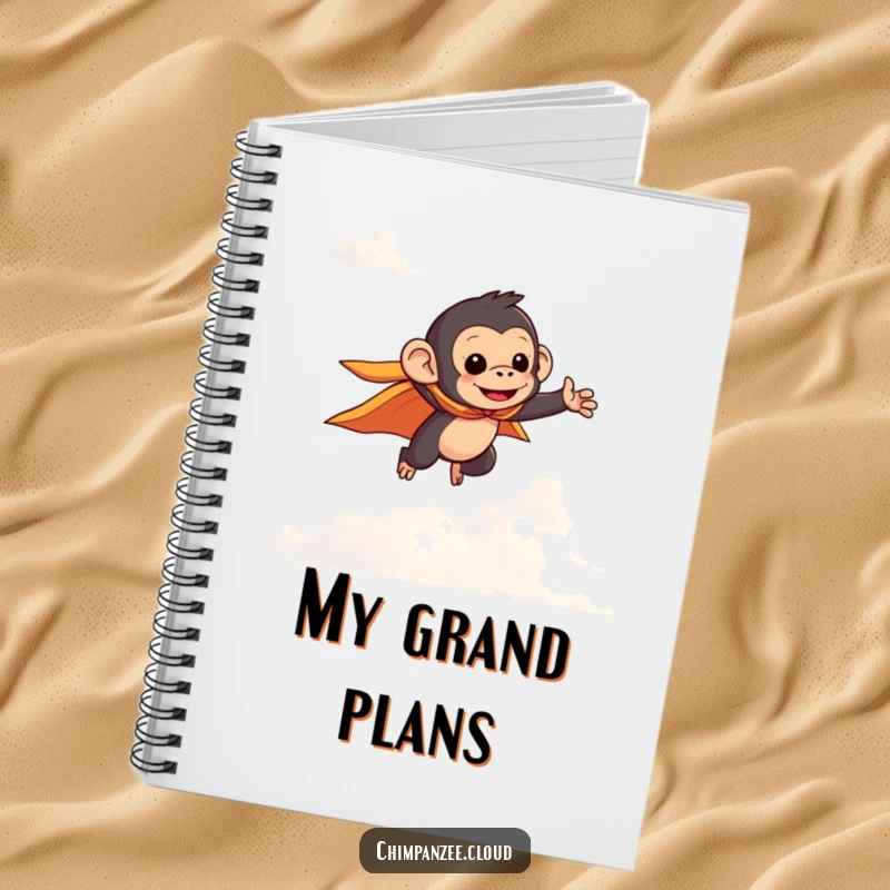 Funny chimpanzee in a small cape flying through clouds, featured on a notebook cover for jotting down heroic and humorous ideas.