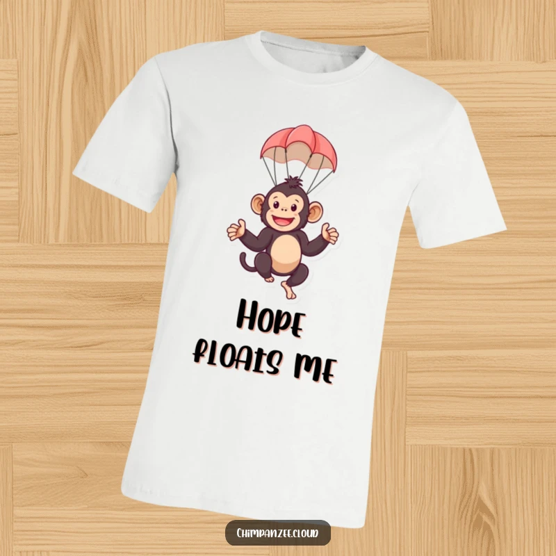 Funny t-shirt featuring a playful chimpanzee character suspended mid-air by a small parachute. A humorous and lighthearted design.