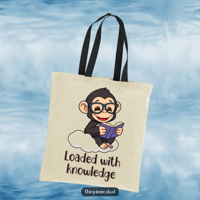 Funny tote bag featuring a happy chimpanzee wearing glasses, reading a book while sitting on a cloud.