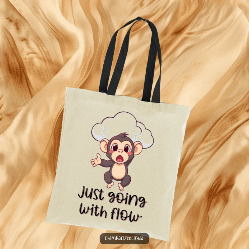 Funny chimpanzee character looking surprised while being tossed by a cloud, featured on a tote bag for humorous utility.